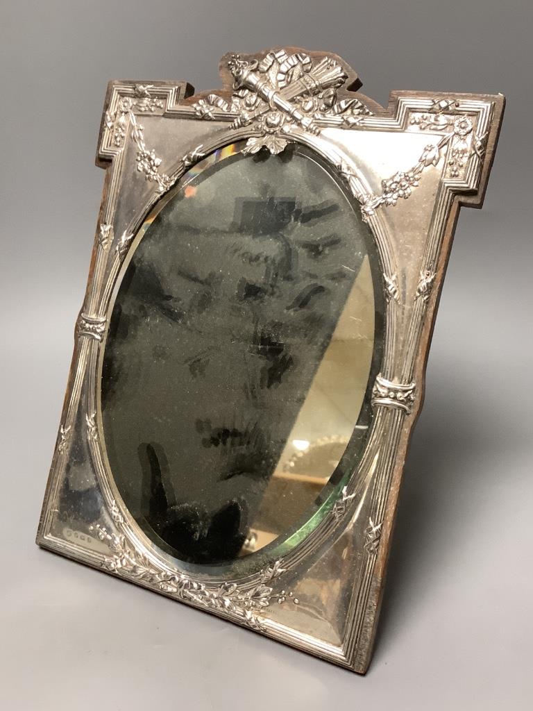 An Edwardian silver mounted easel mirror, with oval plate, James Deakin & Sons, Birmingham, 1908, 29.8cm.